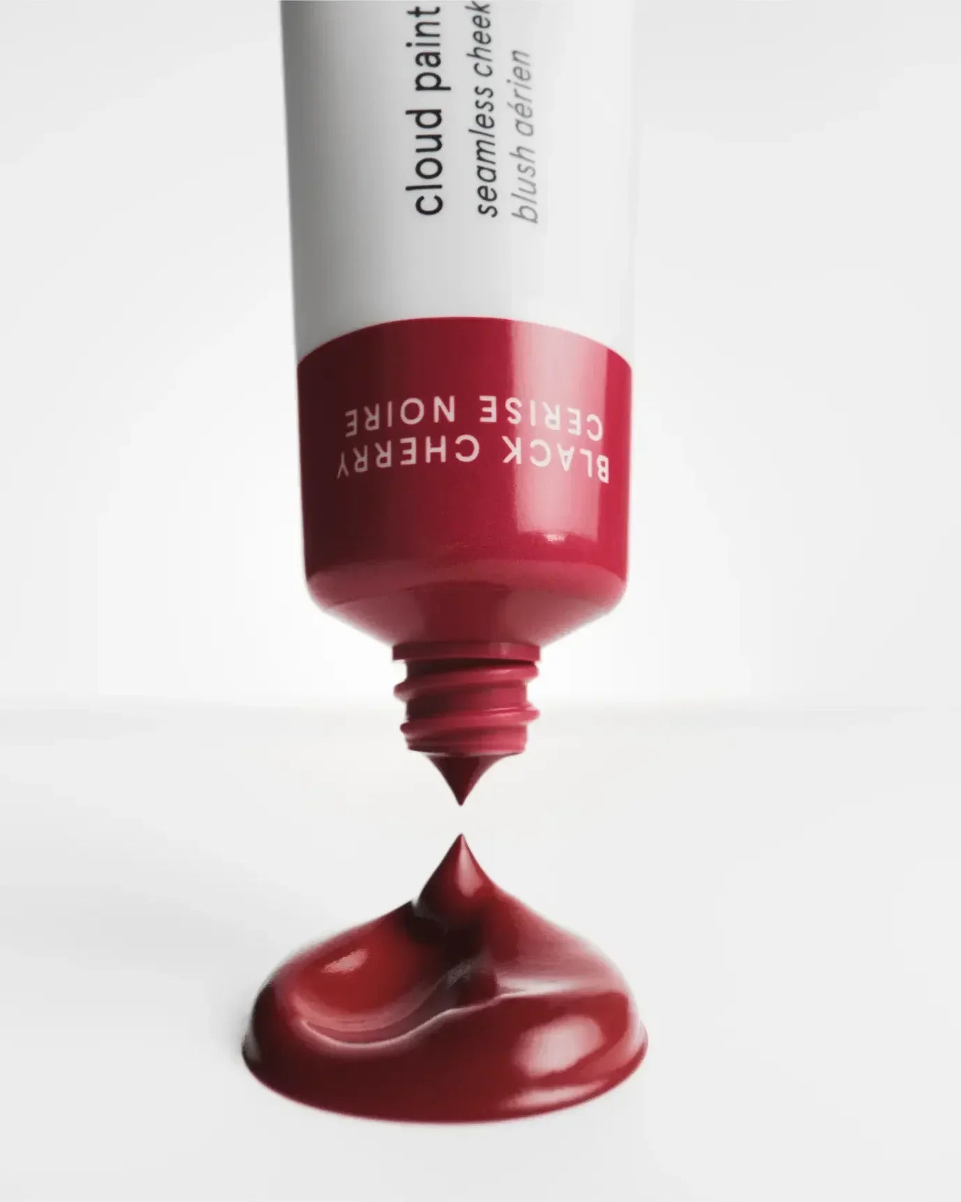 Rich berry-toned liquid blush with creamy texture, seamless finish, and luxurious appeal
