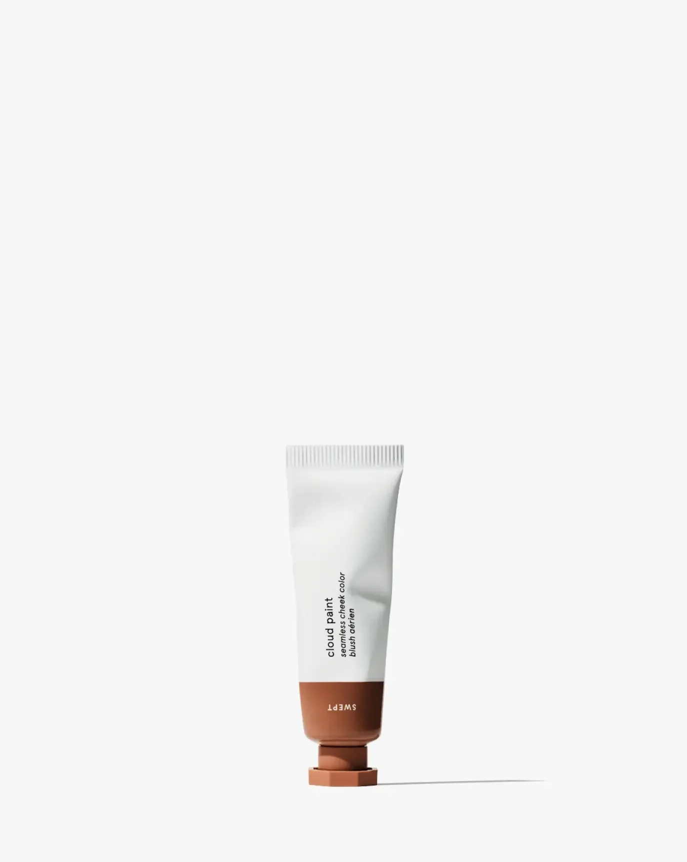 Creamy brown blush in a sleek tube with a soft, dewy finish and minimalist design
