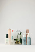Wylde Grey luxurious mini essentials kit with pump bottles, creamy textures, pastel hues