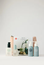 Wylde Grey luxurious mini essentials kit with pump bottles, creamy textures, pastel hues