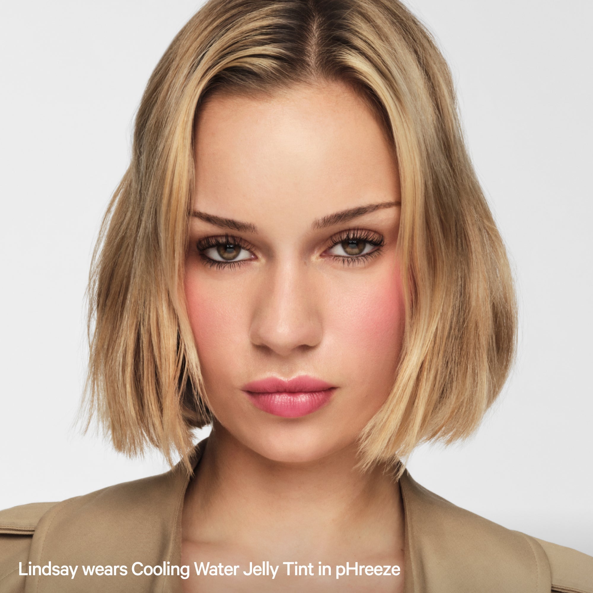 Woman with short blonde hair wearing pink Cooling Water Jelly Tint blush and lip color