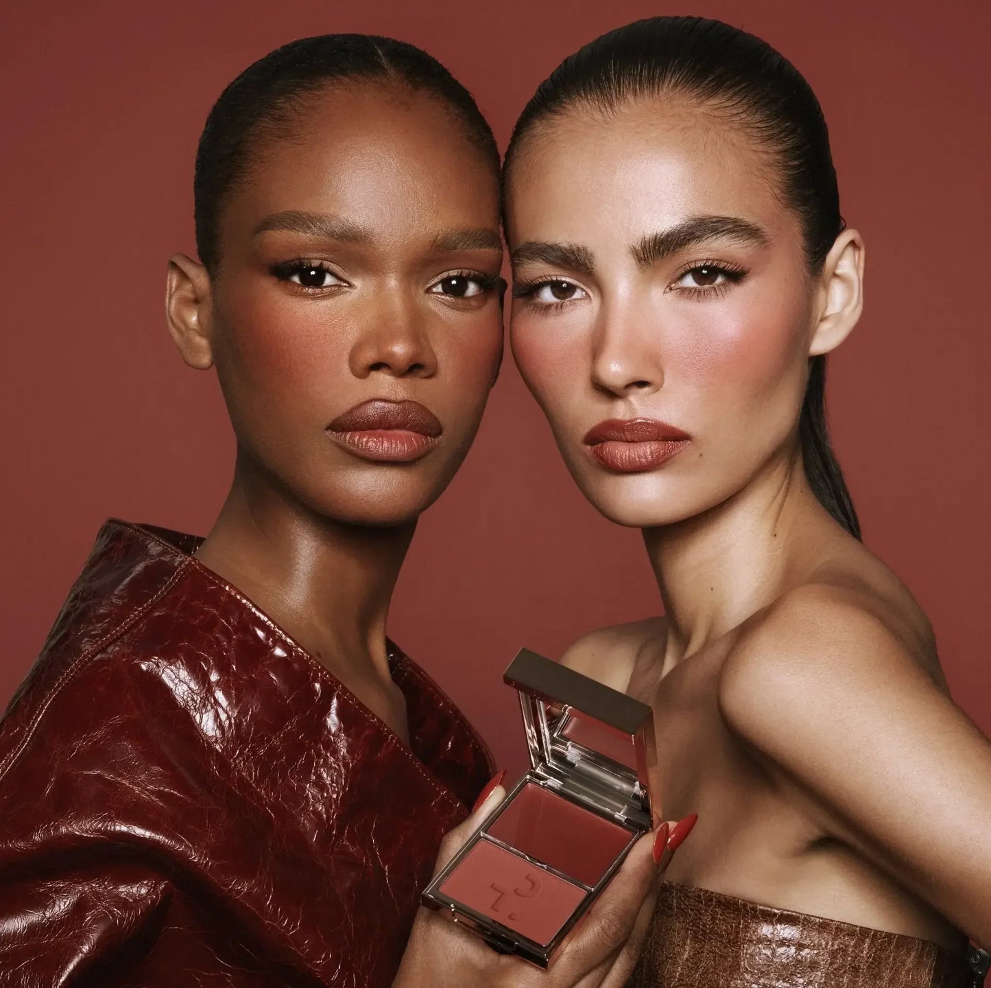 Two models with flawless, rosy blush and creamy, powder blush duo in rich berry tones