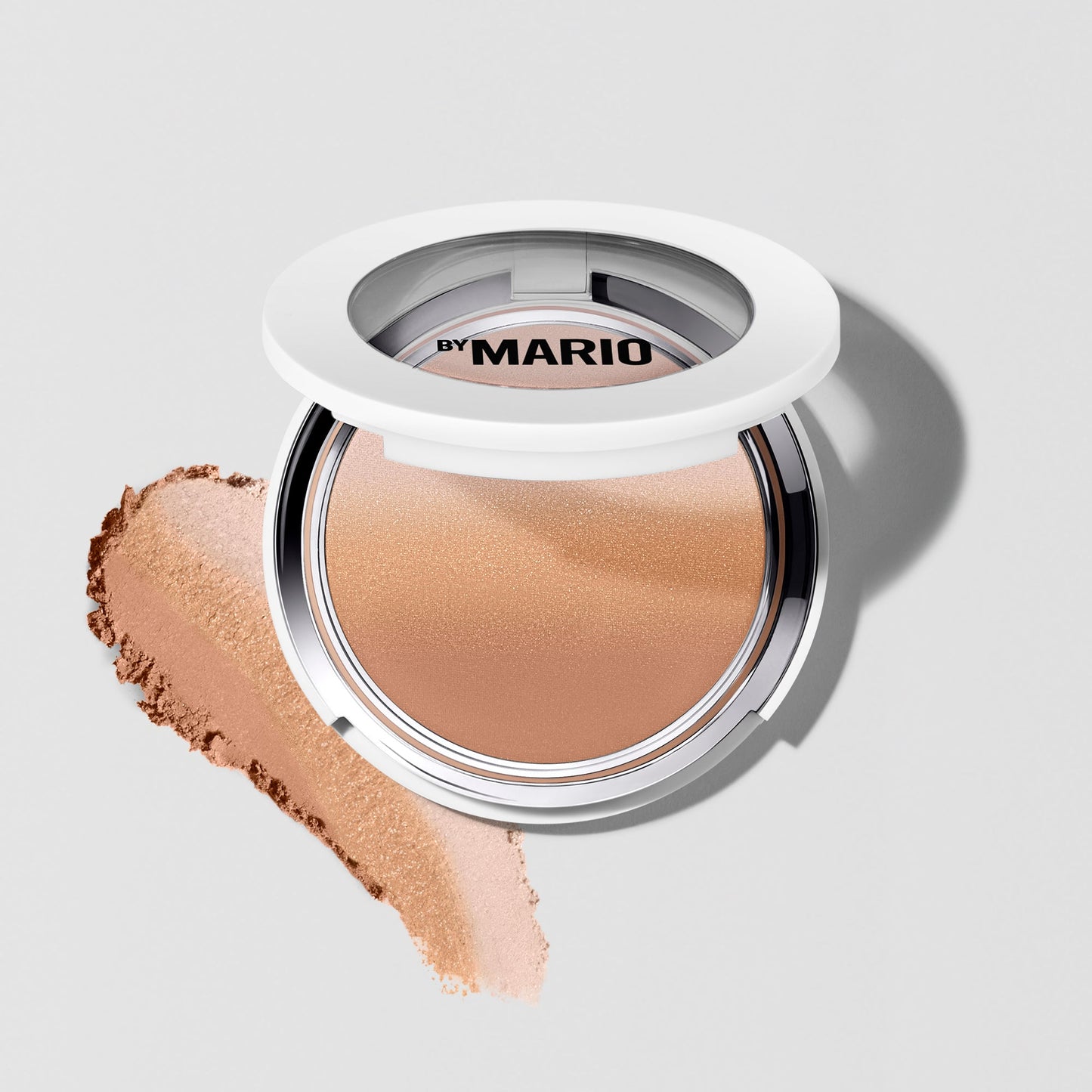 Light-medium pressed powder compact with silky, warm beige and honey tones, smooth texture