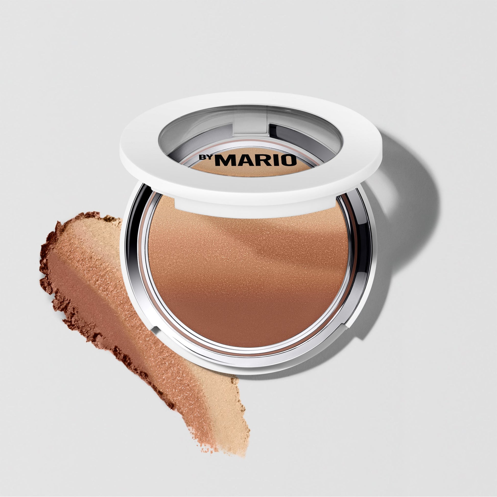 Luxurious medium-dark bronzer with a silky, matte finish and warm brown tones.