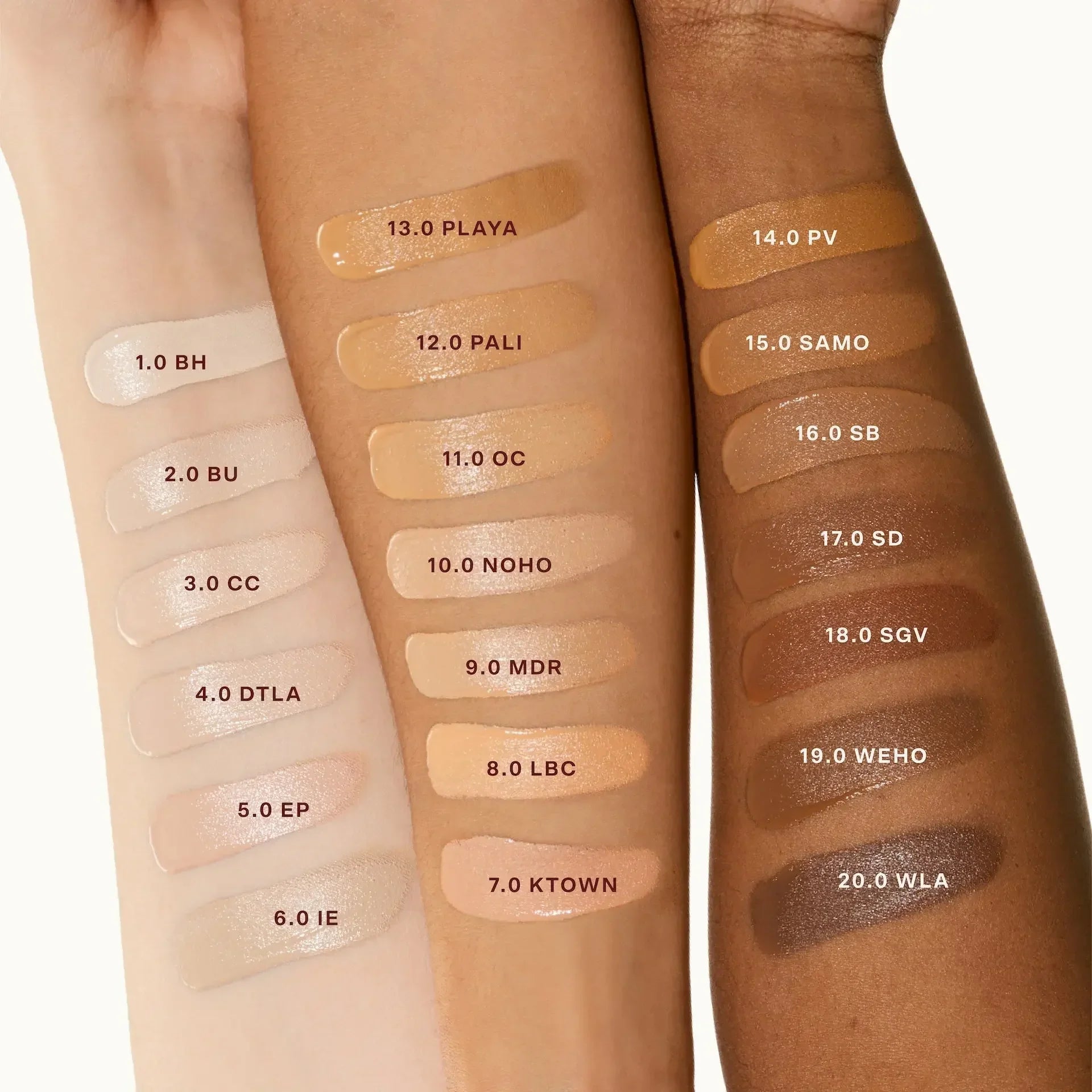 Three arms displaying creamy serum concealer swatches in multiple shades with dewy finish.
