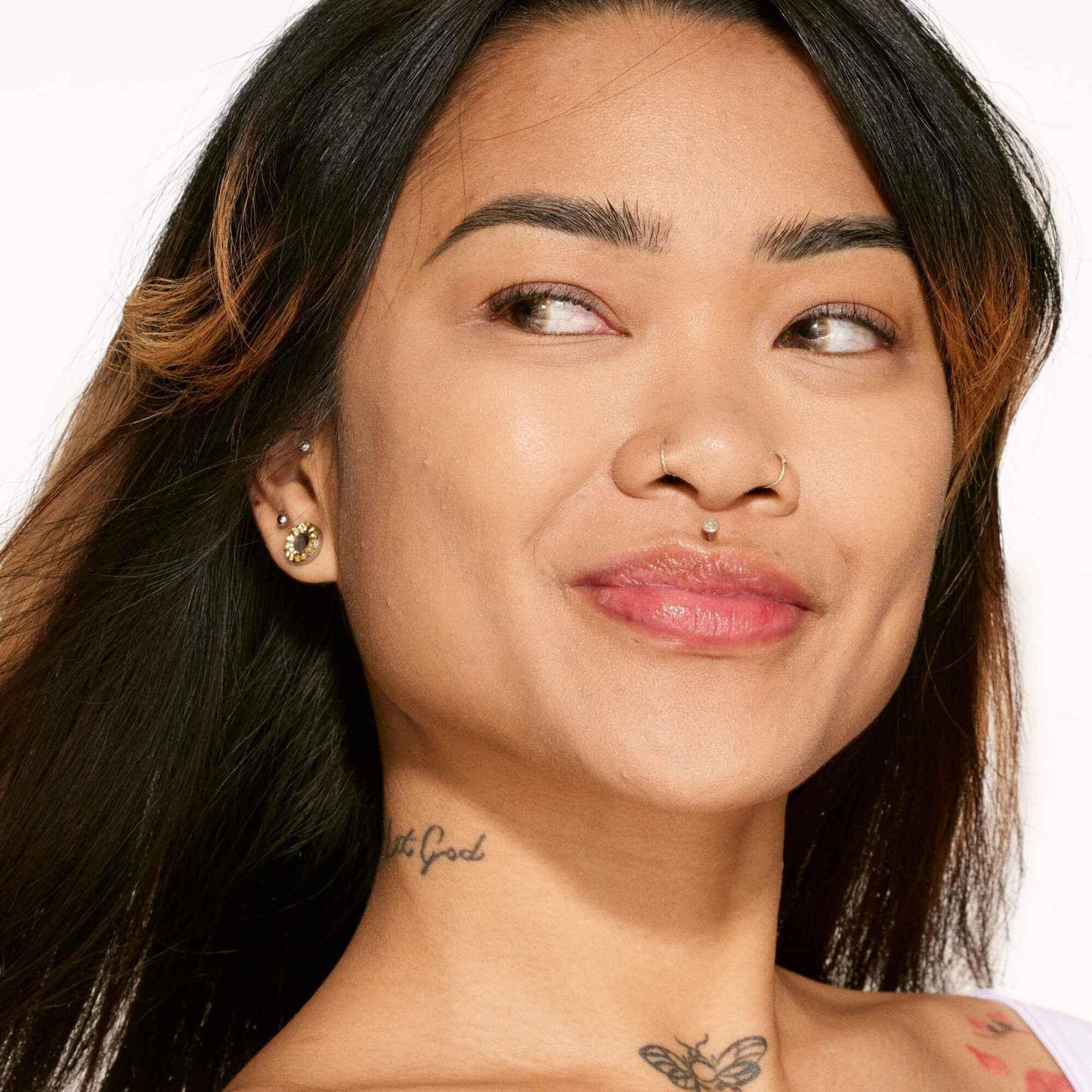 Close-up of woman with smooth dewy complexion, natural makeup, and glossy lips