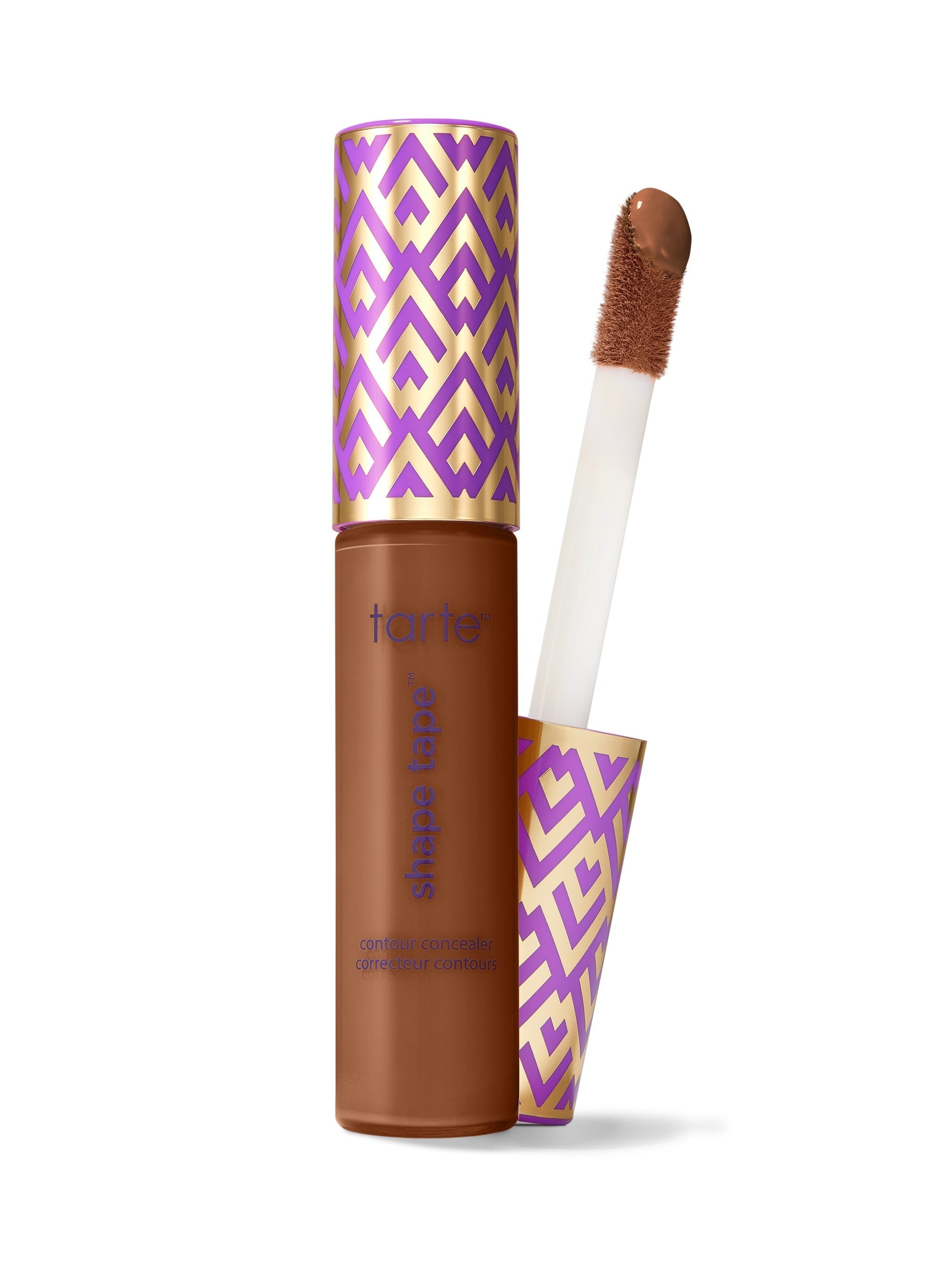 Makeup product with a brush and purple and gold packaging on a white background